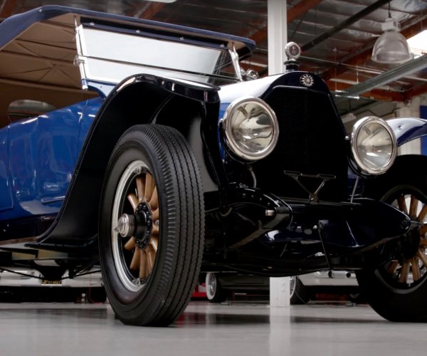 Jay Leno looks at a hybrid from 1916